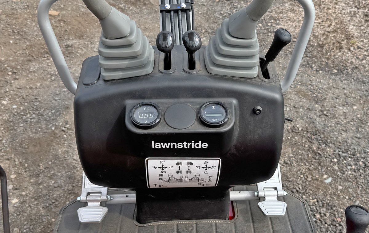 CREX6-M mini excavator, twin joysticks and foot pedals at the operator station