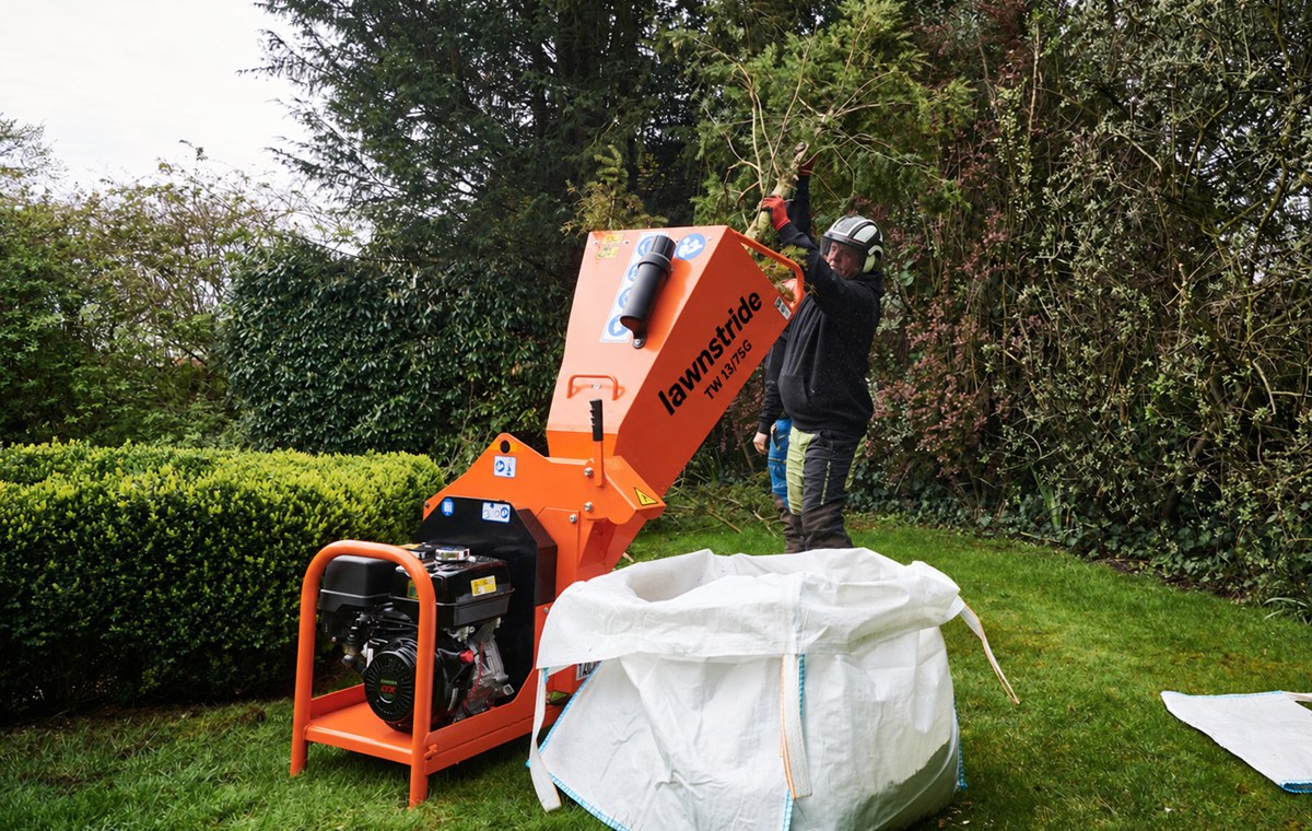 TW 13/75G petrol wood chipper, discharge aimed into a collection bag