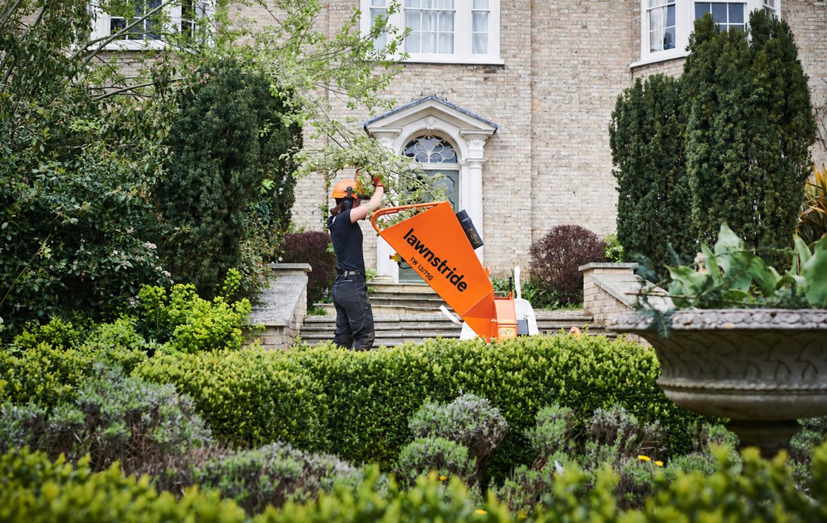 TW 13/75G petrol wood chipper, in use on a landscaping job